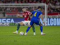 Zsolt Nagy of Hungary competes for the ball with Jusuf Gazibegovic of Bosnia and Herzegovina during the UEFA Nations League Group A3 match a...