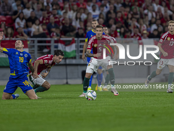 Dominik Szoboszlai of Hungary competes for the ball with Dario Saric of Bosnia and Herzegovina during the UEFA Nations League Group A3 match...