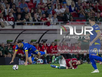 Adrian Leon Barisic of Bosnia and Herzegovina competes for the ball with Bendeguz Bolla of Hungary during the UEFA Nations League Group A3 m...