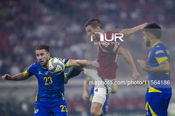 Barnabas Varga of Hungary competes for the ball with Ermin Bicakcic of Bosnia and Herzegovina during the UEFA Nations League Group A3 match...