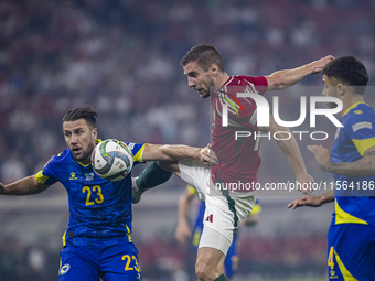 Barnabas Varga of Hungary competes for the ball with Ermin Bicakcic of Bosnia and Herzegovina during the UEFA Nations League Group A3 match...