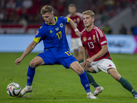 Dzenic Burnic of Bosnia and Herzegovina competes for the ball with Andras Schafer of Hungary during the UEFA Nations League Group A3 match a...