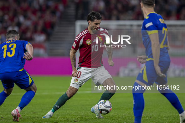 Dominik Szoboszlai of Hungary competes for the ball with Ivan Basic of Bosnia and Herzegovina during the UEFA Nations League Group A3 match...