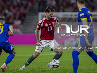 Dominik Szoboszlai of Hungary competes for the ball with Ivan Basic of Bosnia and Herzegovina during the UEFA Nations League Group A3 match...