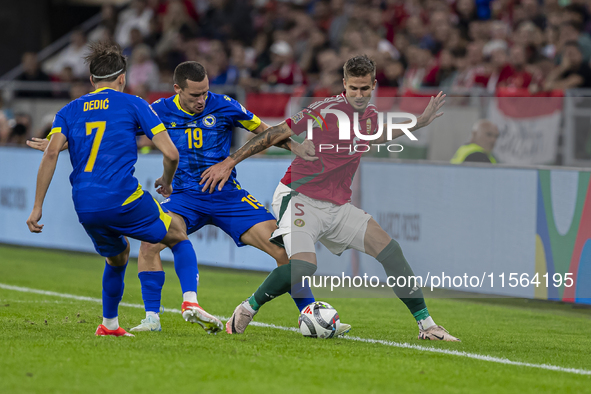 Dario Saric of Bosnia and Herzegovina competes for the ball with Tamas Nikitscher of Hungary during the UEFA Nations League Group A3 match a...