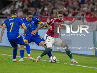 Dario Saric of Bosnia and Herzegovina competes for the ball with Tamas Nikitscher of Hungary during the UEFA Nations League Group A3 match a...