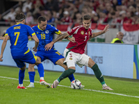 Dario Saric of Bosnia and Herzegovina competes for the ball with Tamas Nikitscher of Hungary during the UEFA Nations League Group A3 match a...