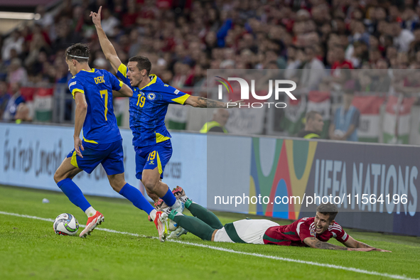 Dario Saric of Bosnia and Herzegovina competes for the ball with Tamas Nikitscher of Hungary during the UEFA Nations League Group A3 match a...