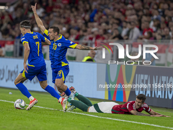 Dario Saric of Bosnia and Herzegovina competes for the ball with Tamas Nikitscher of Hungary during the UEFA Nations League Group A3 match a...