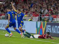 Dario Saric of Bosnia and Herzegovina competes for the ball with Tamas Nikitscher of Hungary during the UEFA Nations League Group A3 match a...