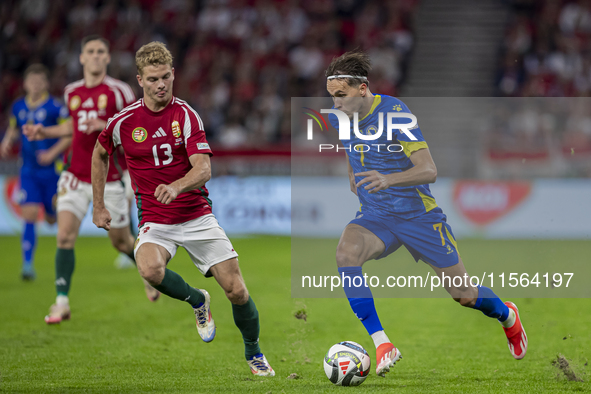 Amar Dedic of Bosnia and Herzegovina competes for the ball with Andras Schafer of Hungary during the UEFA Nations League Group A3 match at P...