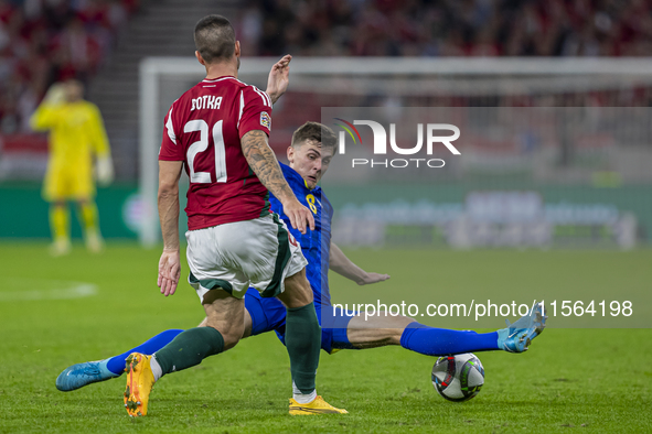 Endre Botka of Hungary competes for the ball with Benjamin Tahirovic of Bosnia and Herzegovina during the UEFA Nations League Group A3 match...