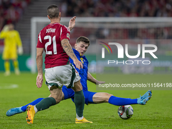 Endre Botka of Hungary competes for the ball with Benjamin Tahirovic of Bosnia and Herzegovina during the UEFA Nations League Group A3 match...