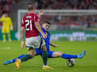 Endre Botka of Hungary competes for the ball with Benjamin Tahirovic of Bosnia and Herzegovina during the UEFA Nations League Group A3 match...