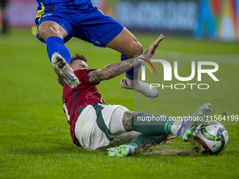 Endre Botka of Hungary competes for the ball with Benjamin Tahirovic of Bosnia and Herzegovina during the UEFA Nations League Group A3 match...