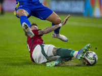 Endre Botka of Hungary competes for the ball with Benjamin Tahirovic of Bosnia and Herzegovina during the UEFA Nations League Group A3 match...