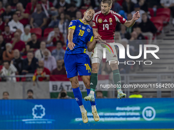 Barnabas Varga of Hungary competes for the ball with Nikola Katic of Bosnia and Herzegovina during the UEFA Nations League Group A3 match at...