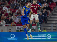 Barnabas Varga of Hungary competes for the ball with Nikola Katic of Bosnia and Herzegovina during the UEFA Nations League Group A3 match at...