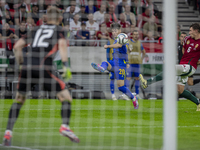 Esmir Bajraktarevic of Bosnia and Herzegovina competes for the ball with Willi Orban of Hungary during the UEFA Nations League Group A3 matc...