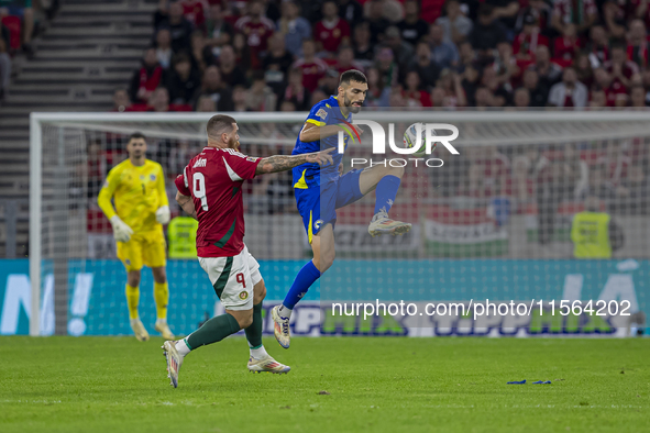 Adrian Leon Barisic of Bosnia and Herzegovina competes for the ball with Martin Adam of Hungary during the UEFA Nations League Group A3 matc...