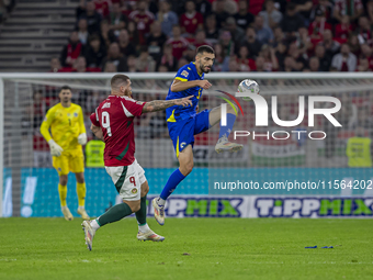 Adrian Leon Barisic of Bosnia and Herzegovina competes for the ball with Martin Adam of Hungary during the UEFA Nations League Group A3 matc...