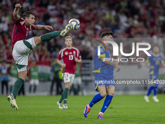 Willi Orban of Hungary competes for the ball with Armin Gigovic of Bosnia and Herzegovina during the UEFA Nations League Group A3 match at P...