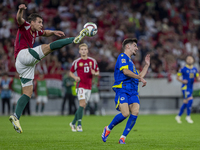 Willi Orban of Hungary competes for the ball with Armin Gigovic of Bosnia and Herzegovina during the UEFA Nations League Group A3 match at P...