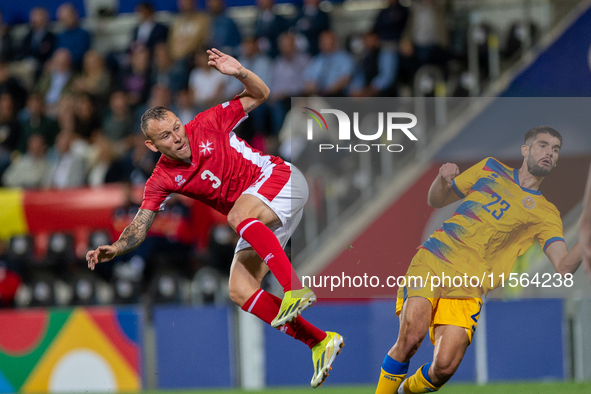 In Andorra La Vella, Andorra, on September 10, 2024, Ryan Camenzuli of Malta and Biel Borra of Andorra compete for the ball during the UEFA...