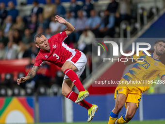 In Andorra La Vella, Andorra, on September 10, 2024, Ryan Camenzuli of Malta and Biel Borra of Andorra compete for the ball during the UEFA...