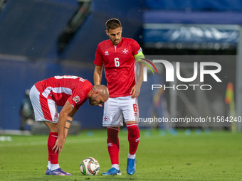 In Andorra La Vella, Andorra, on September 10, 2024, Matthew Guillaumier of Malta and Teddy Teuma of Malta are in action during the UEFA Nat...