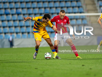 Joan Cervos of Andorra and Ryan Camenzuli of Malta are in action during the UEFA Nations League 2024 - League phase - Matchday 2 match betwe...