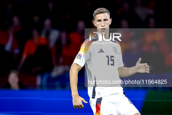 Germany defender Nico Schlotterbeck plays during the match between the Netherlands and Germany at the Johan Cruijff ArenA for the UEFA Natio...