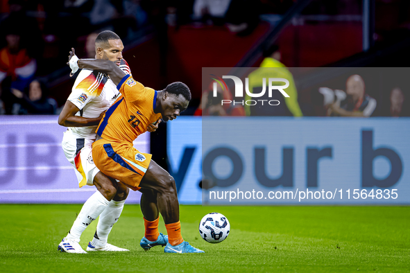 Germany defender Jonathan Tah and Netherlands forward Brian Brobbey during the match between the Netherlands and Germany at the Johan Cruijf...