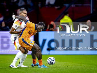 Germany defender Jonathan Tah and Netherlands forward Brian Brobbey during the match between the Netherlands and Germany at the Johan Cruijf...