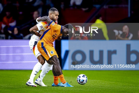 Germany defender Jonathan Tah and Netherlands forward Brian Brobbey during the match between the Netherlands and Germany at the Johan Cruijf...