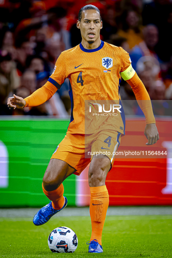 Netherlands defender Virgil van Dijk plays during the match between the Netherlands and Germany at the Johan Cruijff ArenA for the UEFA Nati...