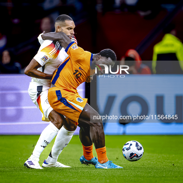 Germany defender Jonathan Tah and Netherlands forward Brian Brobbey during the match between the Netherlands and Germany at the Johan Cruijf...