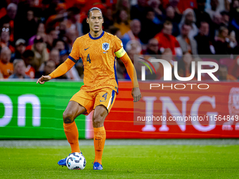 Netherlands defender Virgil van Dijk plays during the match between the Netherlands and Germany at the Johan Cruijff ArenA for the UEFA Nati...