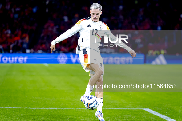 Germany midfielder Florian Wirtz plays during the match between the Netherlands and Germany at the Johan Cruijff ArenA for the UEFA Nations...