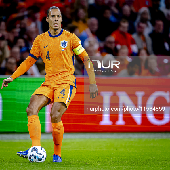 Netherlands defender Virgil van Dijk plays during the match between the Netherlands and Germany at the Johan Cruijff ArenA for the UEFA Nati...