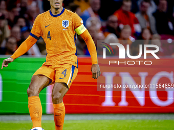 Netherlands defender Virgil van Dijk plays during the match between the Netherlands and Germany at the Johan Cruijff ArenA for the UEFA Nati...