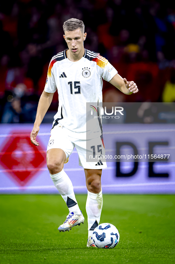 Germany defender Nico Schlotterbeck plays during the match between the Netherlands and Germany at the Johan Cruijff ArenA for the UEFA Natio...