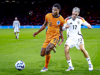 Netherlands defender Denzel Dumfries and Germany midfielder Florian Wirtz during the match between the Netherlands and Germany at the Johan...