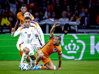 Germany midfielder Jamal Musiala and Netherlands midfielder Xavi Simons during the match between the Netherlands and Germany at the Johan Cr...