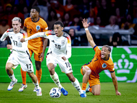 Germany midfielder Jamal Musiala and Netherlands midfielder Xavi Simons during the match between the Netherlands and Germany at the Johan Cr...