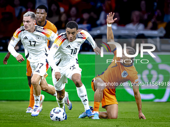 Germany midfielder Jamal Musiala and Netherlands midfielder Xavi Simons during the match between the Netherlands and Germany at the Johan Cr...