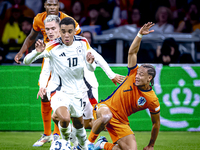 Germany midfielder Jamal Musiala and Netherlands midfielder Xavi Simons during the match between the Netherlands and Germany at the Johan Cr...