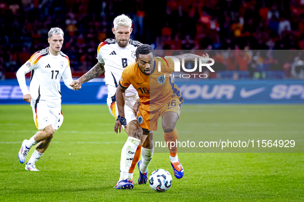 Germany midfielder Robert Andrich and Netherlands midfielder Quinten Timber during the match between the Netherlands and Germany at the Joha...