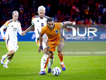 Germany midfielder Robert Andrich and Netherlands midfielder Quinten Timber during the match between the Netherlands and Germany at the Joha...