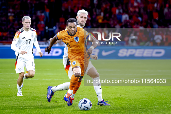 Germany midfielder Robert Andrich and Netherlands midfielder Quinten Timber during the match between the Netherlands and Germany at the Joha...